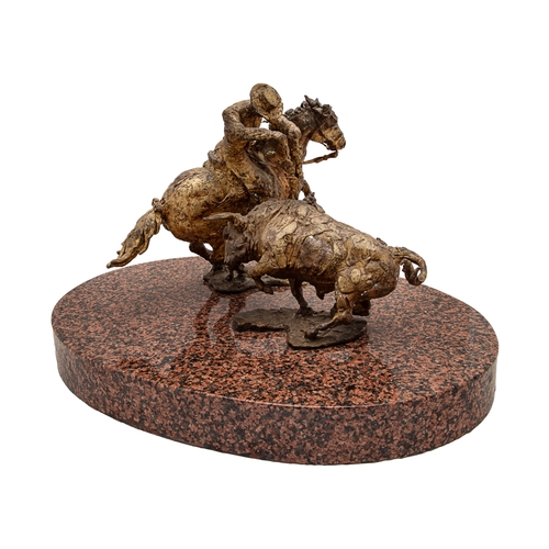 495 - Mexican, c. 1970A striking gilt bronze sculpture of a picador engaging a bullOn an oval granite plin... 