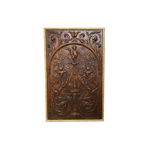 547 - Italian18th centuryA carved walnut plaque, with stylised foliage and puttiTo be sold without reserve... 