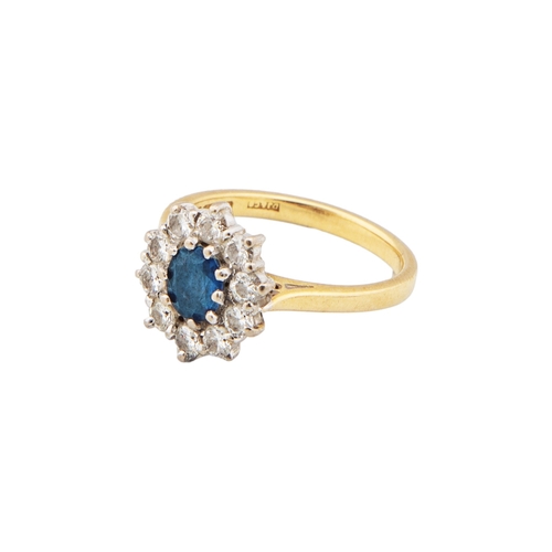 70 - A Sapphire and diamond cluster ringThe oval mixed cut sapphire within a surround of ten small brilli... 