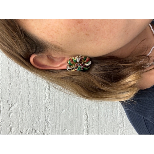 67 - Circa 1970A pair of diamond and gem set enamel flower clip earringsThe central stamens set with cabo... 