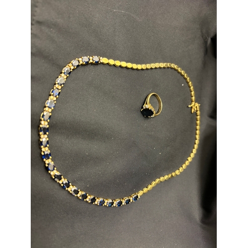 76 - Circa 1980A sapphire, diamond, and gold necklace and ringComprising 22 uniform size oval sapphires w... 