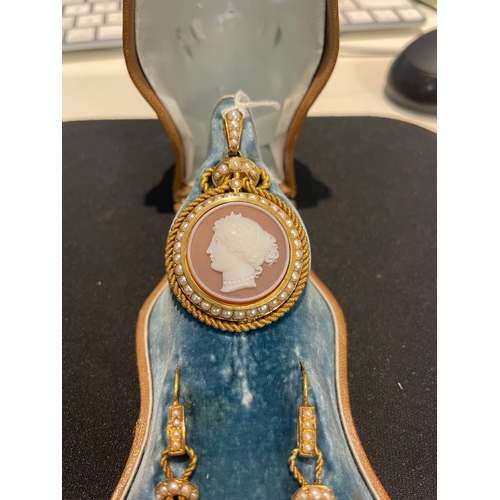 109 - FrenchMid-19th CenturyA hardstone cameo demi-parureComprising:[a] A pendant with finely carved agate... 