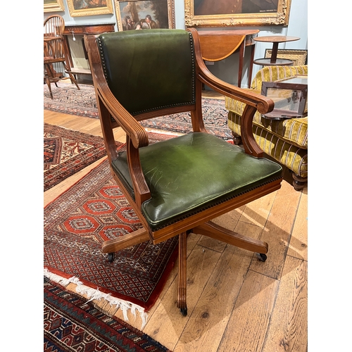 216 - Early 20th Century, A green leather upholstered revolving desk chairTo be sold without reserveProper... 