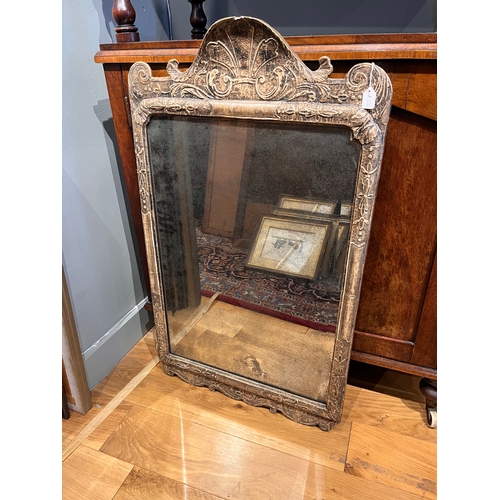 220 - Property of a Gentleman Collector18th CenturyA mirror with a decorative bevelled plateThe silvering ... 