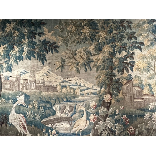 326 - 18th CenturyA very large Aubusson verdure tapestryDepicting crane birds amidst abundant foliage in a... 