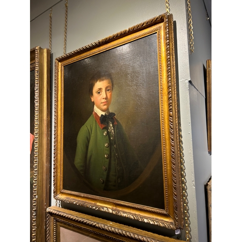 346 - Attributed to Sir Nathaniel Dance-Holland (1735 - 1811)Portrait of a boy in green coat in a feigned ... 