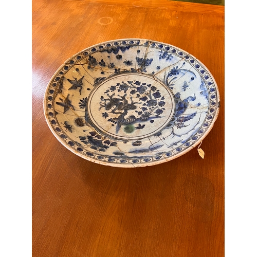 468 - Safavid17th CenturyA large blue and white pottery dish (with damages)Property of an academic collect... 