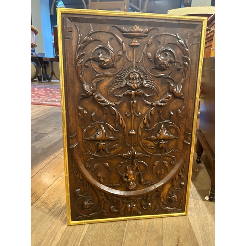 547 - Italian18th centuryA carved walnut plaque, with stylised foliage and puttiTo be sold without reserve... 