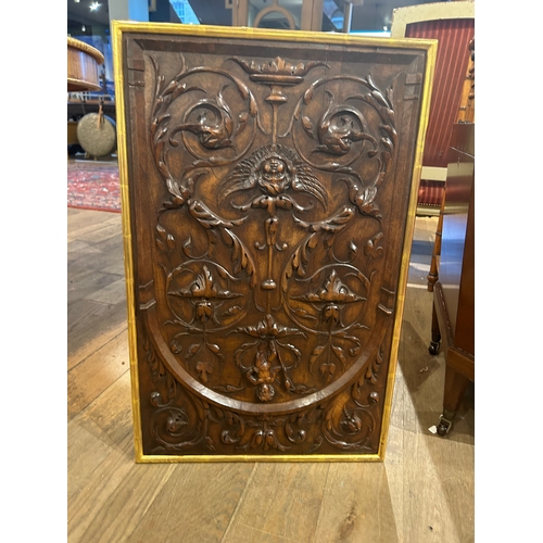 547 - Italian18th centuryA carved walnut plaque, with stylised foliage and puttiTo be sold without reserve... 