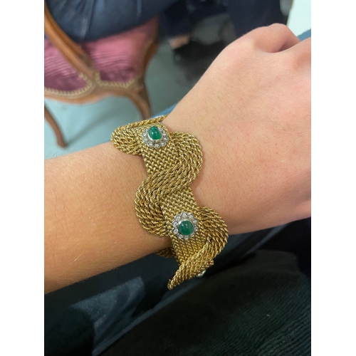 94 - Circa 1950An attractive 18 carat gold interwoven mesh emerald and diamond set braceletThe interwoven... 