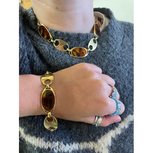 95 - Circa 1970A gold and faux tortoiseshell enamel necklace and braceletThe necklace comprising six oval... 