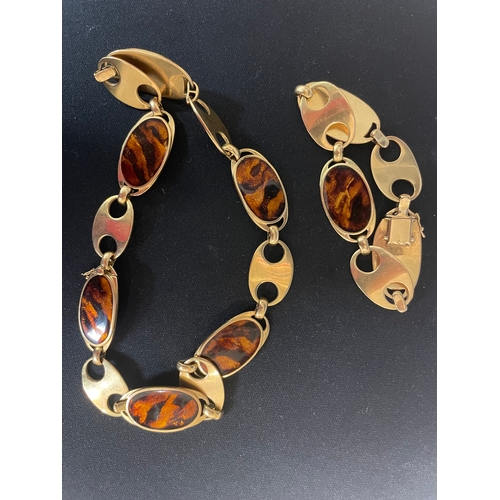 95 - Circa 1970A gold and faux tortoiseshell enamel necklace and braceletThe necklace comprising six oval... 