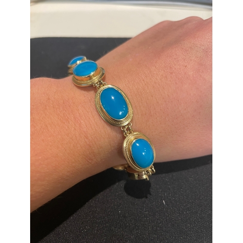 97 - A fine turquoise and 14 carat yellow gold braceletComprising eight graduated oval turquoise in yello... 