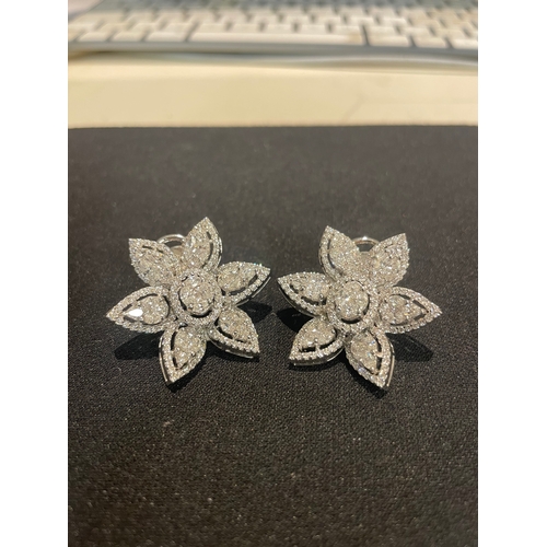 100 - A fine pair of diamond floral earringsSet with, marquise, brilliant, and princess cut diamondsWeight... 