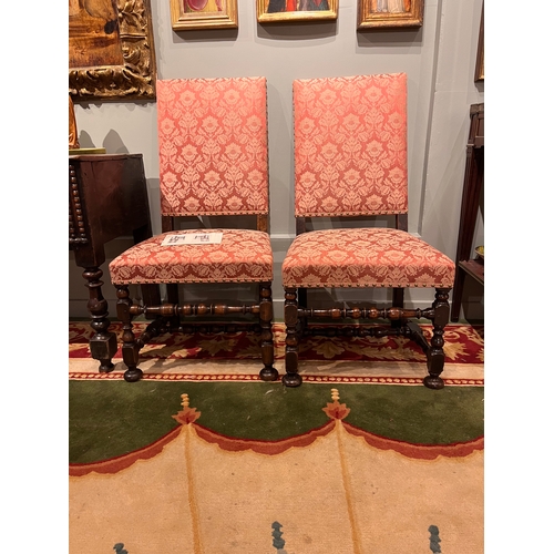 214 - 17th CenturyA pair of William and Mary walnut side chairs upholstered in dry blood damaskOn turned l... 