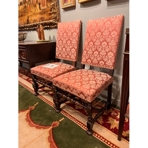 214 - 17th CenturyA pair of William and Mary walnut side chairs upholstered in dry blood damaskOn turned l... 