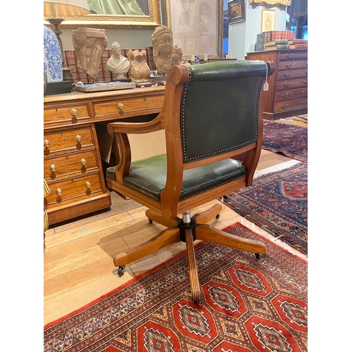 216 - Early 20th Century, A green leather upholstered revolving desk chairTo be sold without reserveProper... 