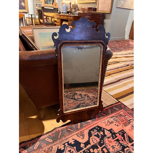 219 - 18th centuryA walnut veneer pier mirror, with old glass and gilded innerDimensions:32 in. (H) x 16 i... 