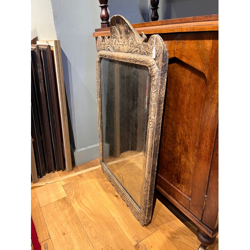 220 - Property of a Gentleman Collector18th CenturyA mirror with a decorative bevelled plateThe silvering ... 