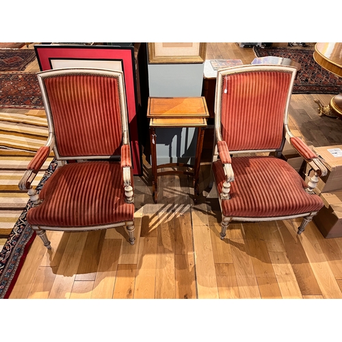 232 - French19th CenturyA pair of white painted and gilded armchairsUpholstered in light burgundy velvetDi... 