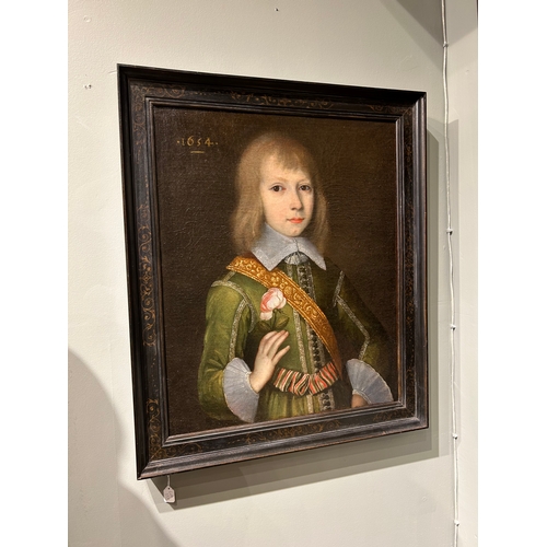 337 - British 17th century school1634, dated lower leftPortrait of a boy, half-length, in a green emb... 