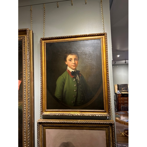 346 - Attributed to Sir Nathaniel Dance-Holland (1735 - 1811)Portrait of a boy in green coat in a feigned ... 