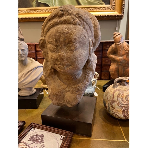 483 - IndianClassical periodA stone/marble (?) deity headDimensions:(Sculpture) 14 in. (H) x 7 in. (W) x 9... 