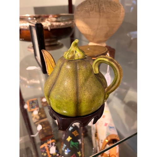 494 - 18th Century or earlierA Chinese gourd teapot with locust spout Realistically modelled with a green ... 