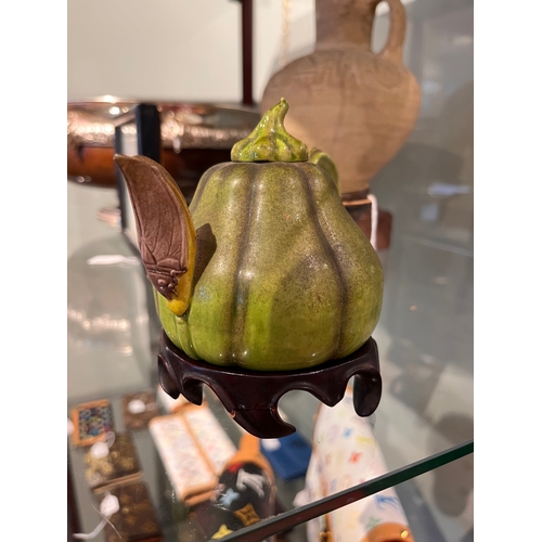 494 - 18th Century or earlierA Chinese gourd teapot with locust spout Realistically modelled with a green ... 