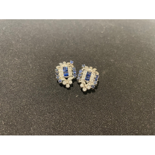 93 - Circa 1940A pair of sapphire and diamond platinum mounted ear clipsSet with calibré and round sapphi... 