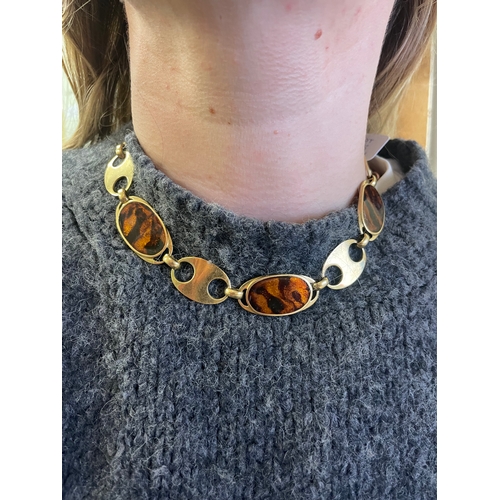 95 - Circa 1970A gold and faux tortoiseshell enamel necklace and braceletThe necklace comprising six oval... 