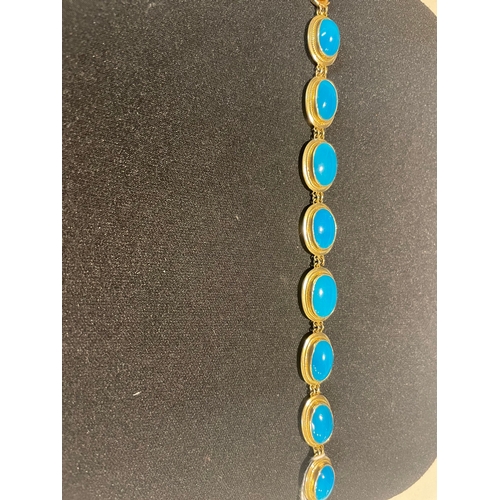 97 - A fine turquoise and 14 carat yellow gold braceletComprising eight graduated oval turquoise in yello... 