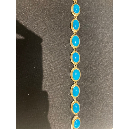 97 - A fine turquoise and 14 carat yellow gold braceletComprising eight graduated oval turquoise in yello... 