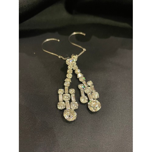 81 - Art DecoA pair of diamond chandelier earringsThe pendants with large old European cut diamond drops,... 
