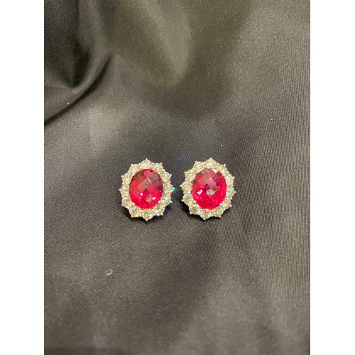 84 - An impressive pair of pink tourmaline and brilliant cut diamond cluster earringsThe oval briollete p... 