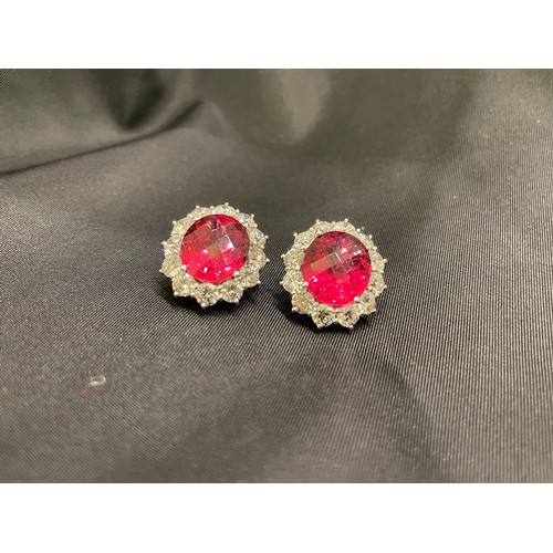 84 - An impressive pair of pink tourmaline and brilliant cut diamond cluster earringsThe oval briollete p... 