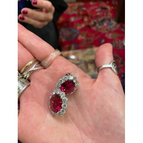 84 - An impressive pair of pink tourmaline and brilliant cut diamond cluster earringsThe oval briollete p... 