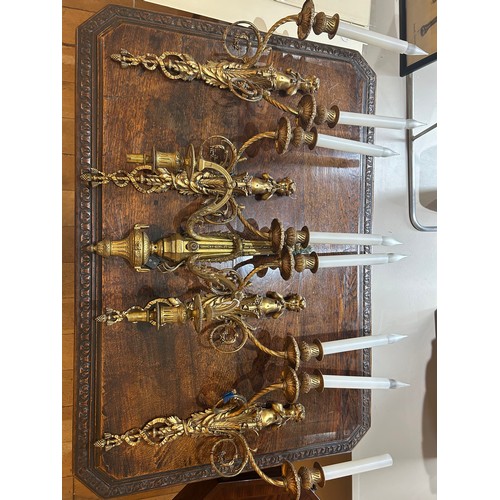 235 - AntiqueFive ormolu twin branch wall lights, four with a small boy playing two horns and a single twi... 