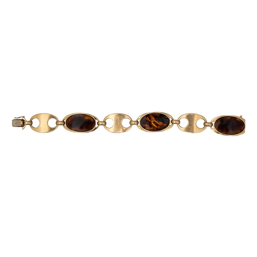 85 - Circa 1970A gold and faux tortoiseshell enamel necklace and braceletThe necklace comprising six oval... 