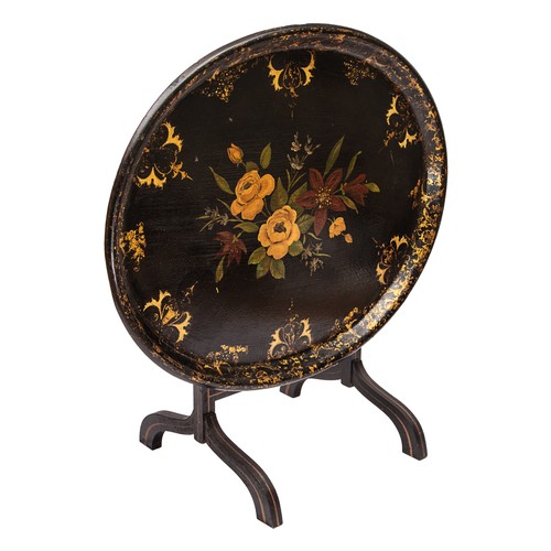 180 - 20th CenturyA black lacquer tilt-top oval tray tableThe tray decorated with flowers and gold motifsO... 