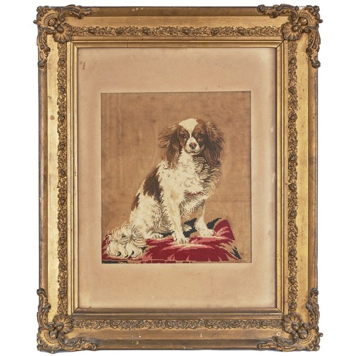 529 - British19th CenturyA cavalier King Charles spaniel needlepointThe spaniel at rest on a floral cushio... 