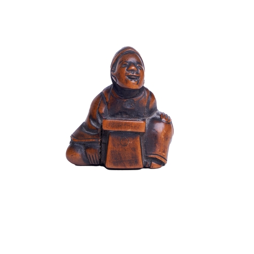 141 - JapanA carved figural netsukeDimensions:1.5 in. (H) x 1.5 in. (W) x 0.75 in. (D)... 