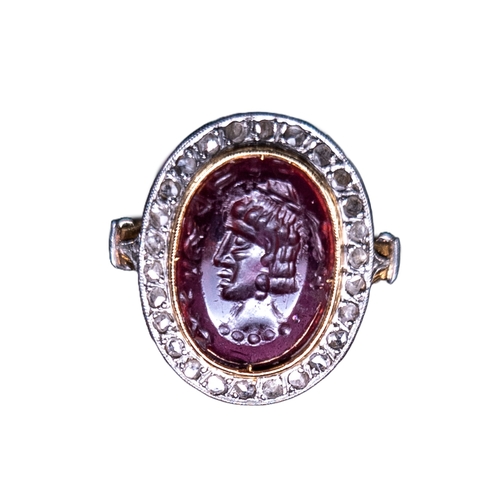 47 - A garnet intaglio ring set with a portrait of a Sassanian rulerWith an inscription in the stoneSet w... 