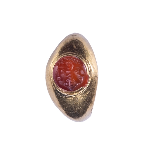 52 - A very unusual Roman intaglio carved in carnelianRepresenting two back to back janus heads with a bu... 