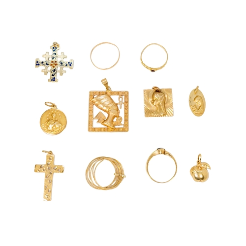 97 - European20th Century[a] Seven various yellow metal pendants[b] Four yellow metal ringsTotal weight:A... 