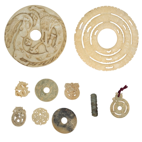 127 - Chinese20th CenturyA group of nephrite pi discs and pendantsComprising of 10 items, including a larg... 