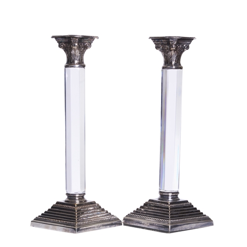 478 - Circa 1980A pair of silverplate and glass candlesticksTopped with Corinthian finialsHallmarks to the... 