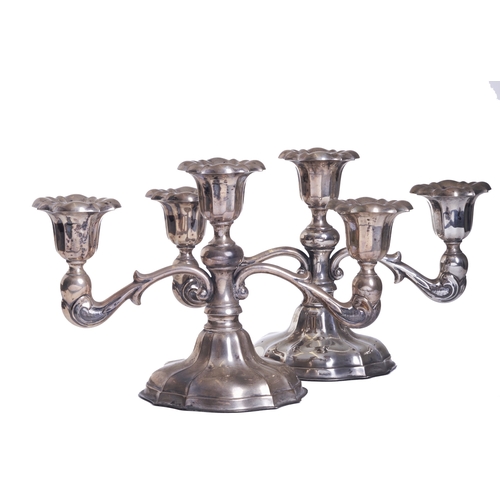 482 - Chinese Early 20th CenturyA pair of sterling silver candelabraDimensions:7 in. (H) x 11 in. (W) x 5 ... 