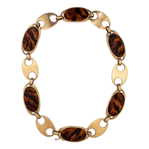 85 - Circa 1970A gold and faux tortoiseshell enamel necklace and braceletThe necklace comprising six oval... 