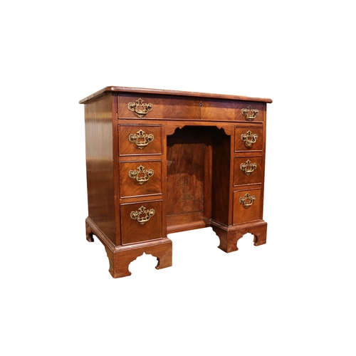 245 - Property of a LadyGeorgianA mahogany kneehole writing deskWith a large central drawers and three sma... 